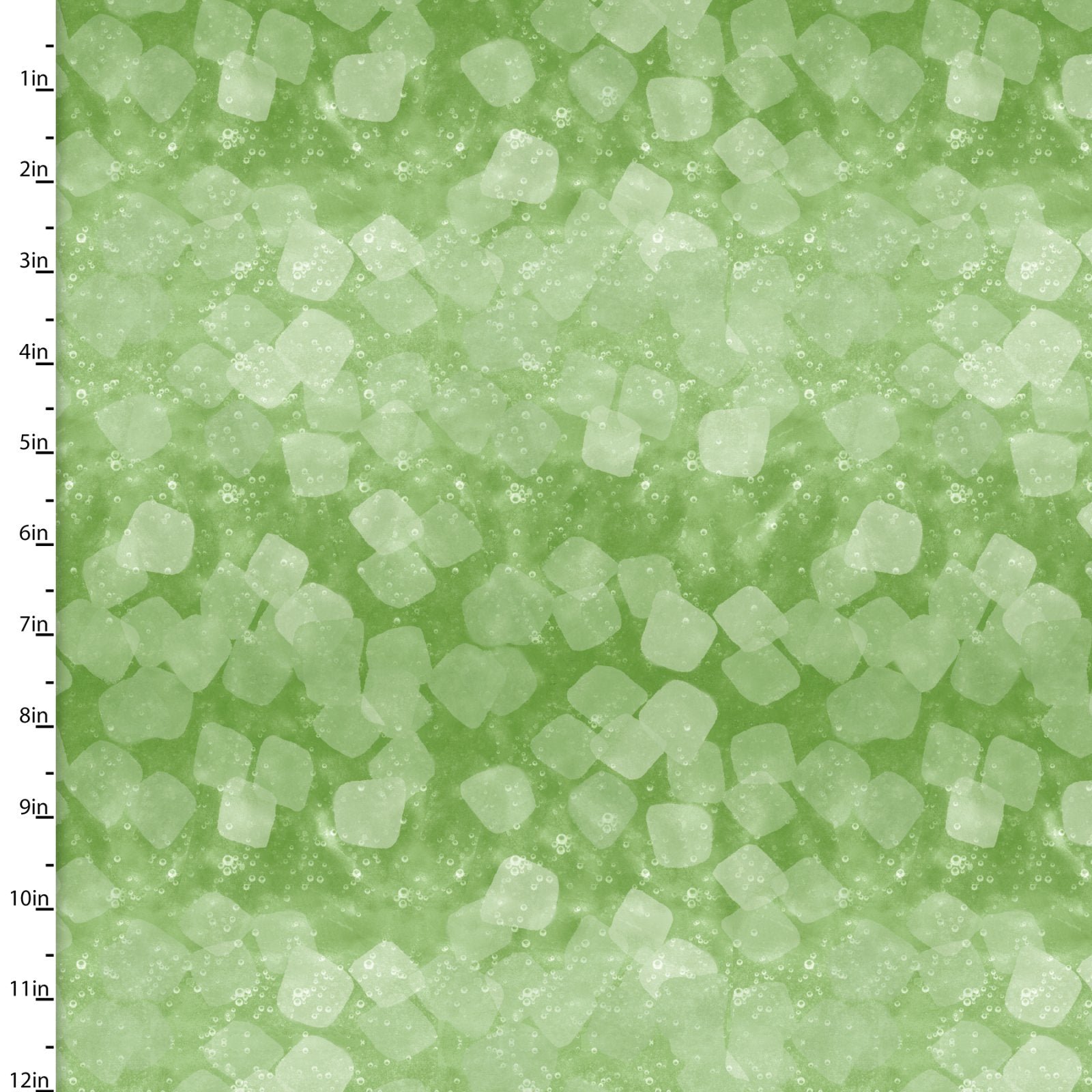 A close-up texture shot of pale green sugar crystals or coarse salt granules on a light green background, with a vertical measurement scale in inches along the left edge.