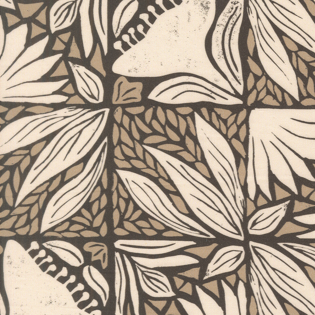 Patterned fabric with leaf design in beige and brown tones.