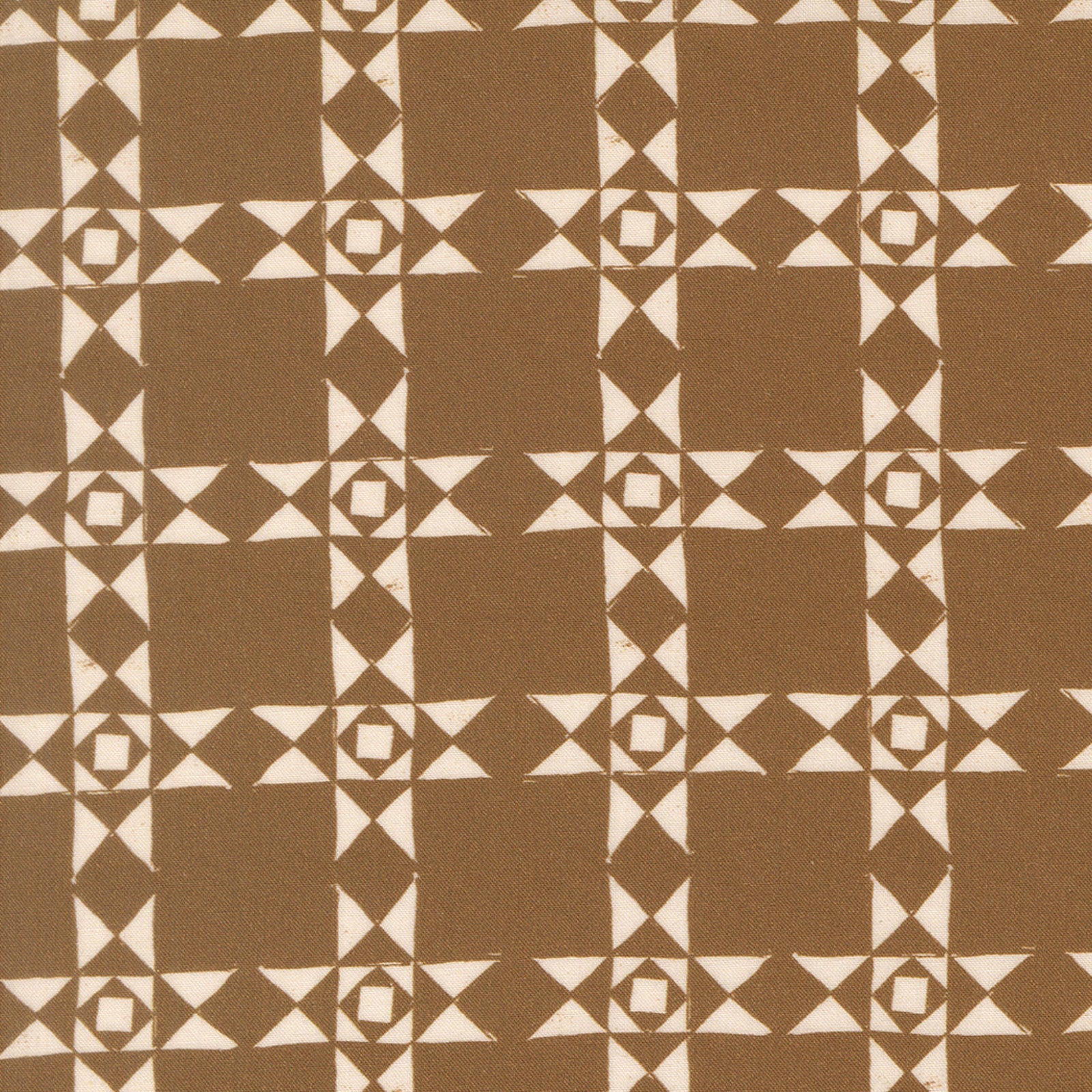 A close-up of a fabric or wallpaper pattern featuring a geometric grid design in warm brown and cream.