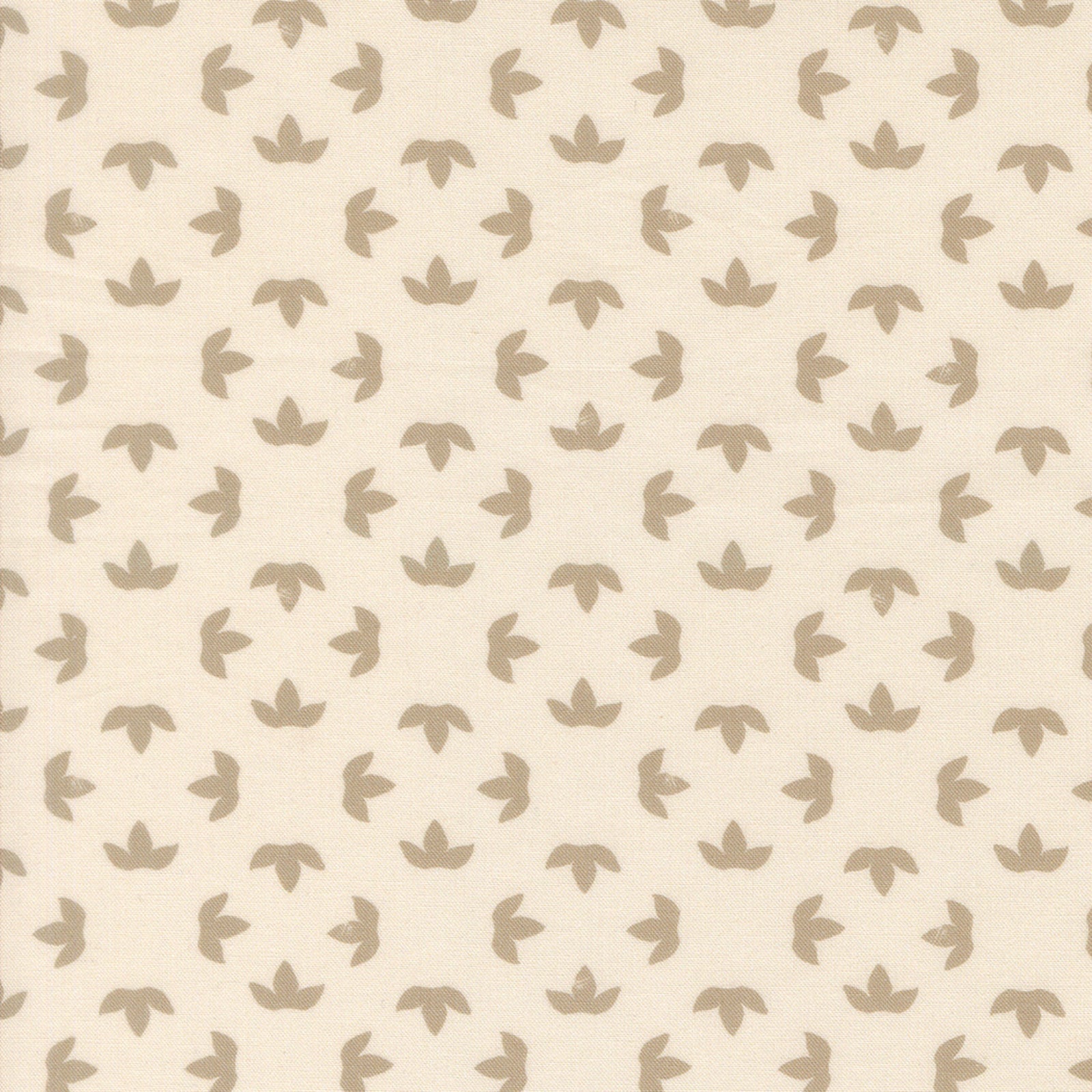 A close-up of a fabric pattern featuring a repeating motif of small, stylized taupe-brown leaf or lotus-like shapes on a warm cream background.