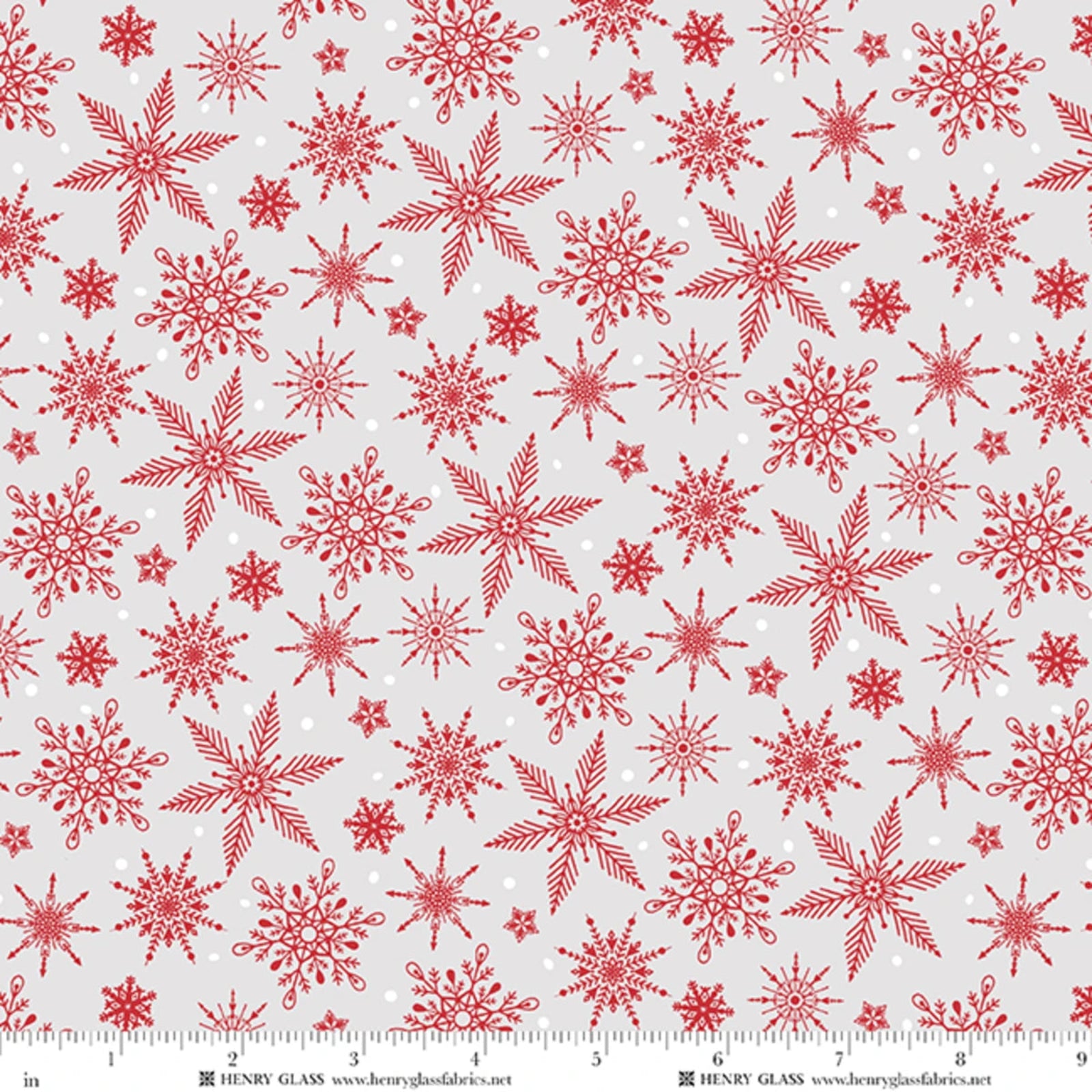 Red snowflake patterned fabric on a light gray background, with a ruler along the bottom edge showing scale and Henry Glass branding.