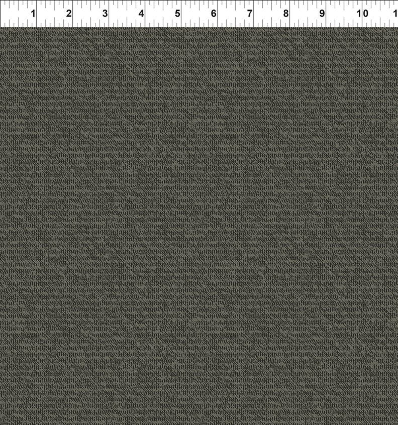 A close-up of a dark charcoal gray textured fabric with a fine woven pattern, shown with a white ruler at the top edge for scale.