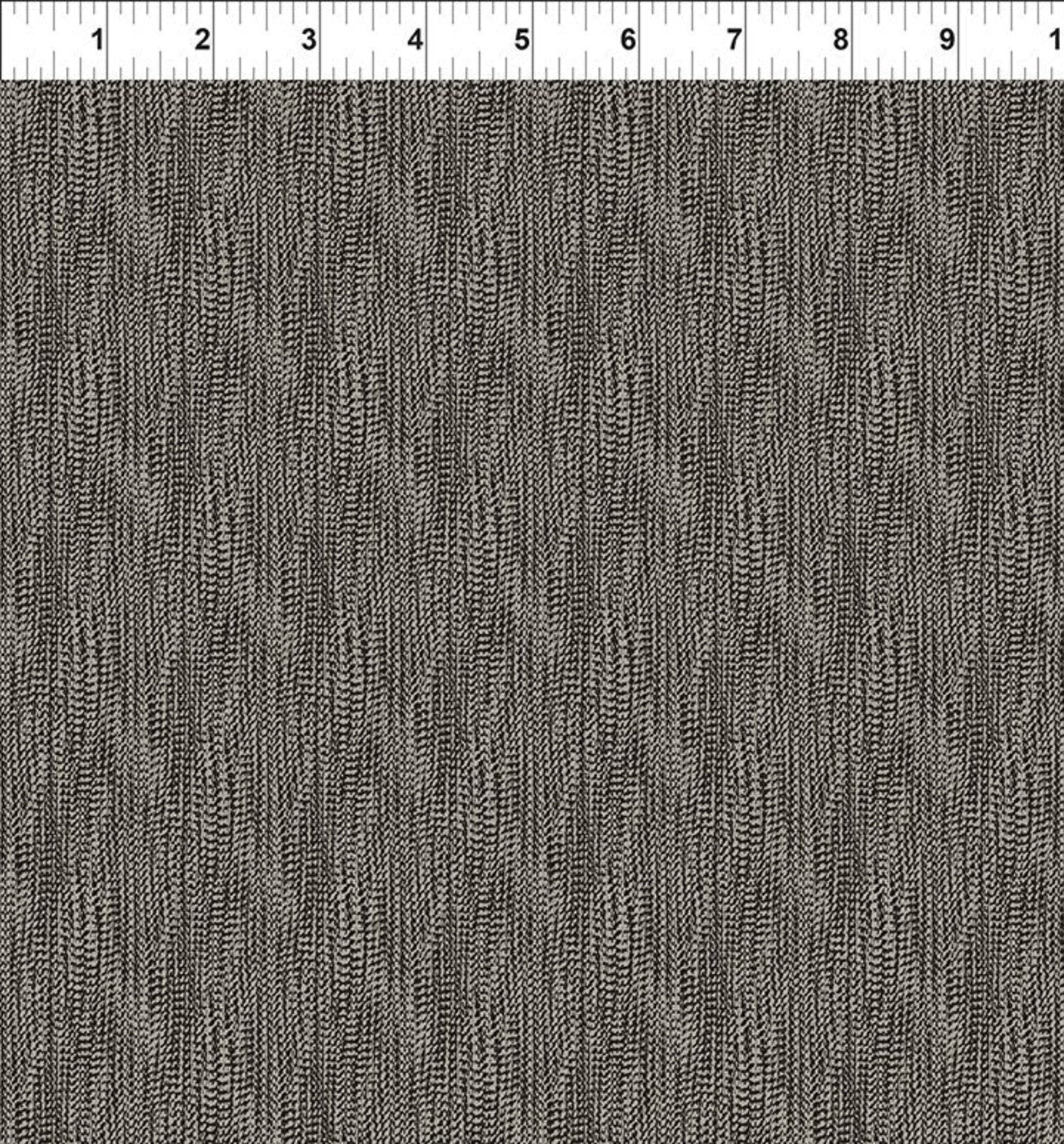 A close-up fabric swatch showing a dark gray and black textured vertical stripe pattern, with a white ruler marked in inches along the top edge.