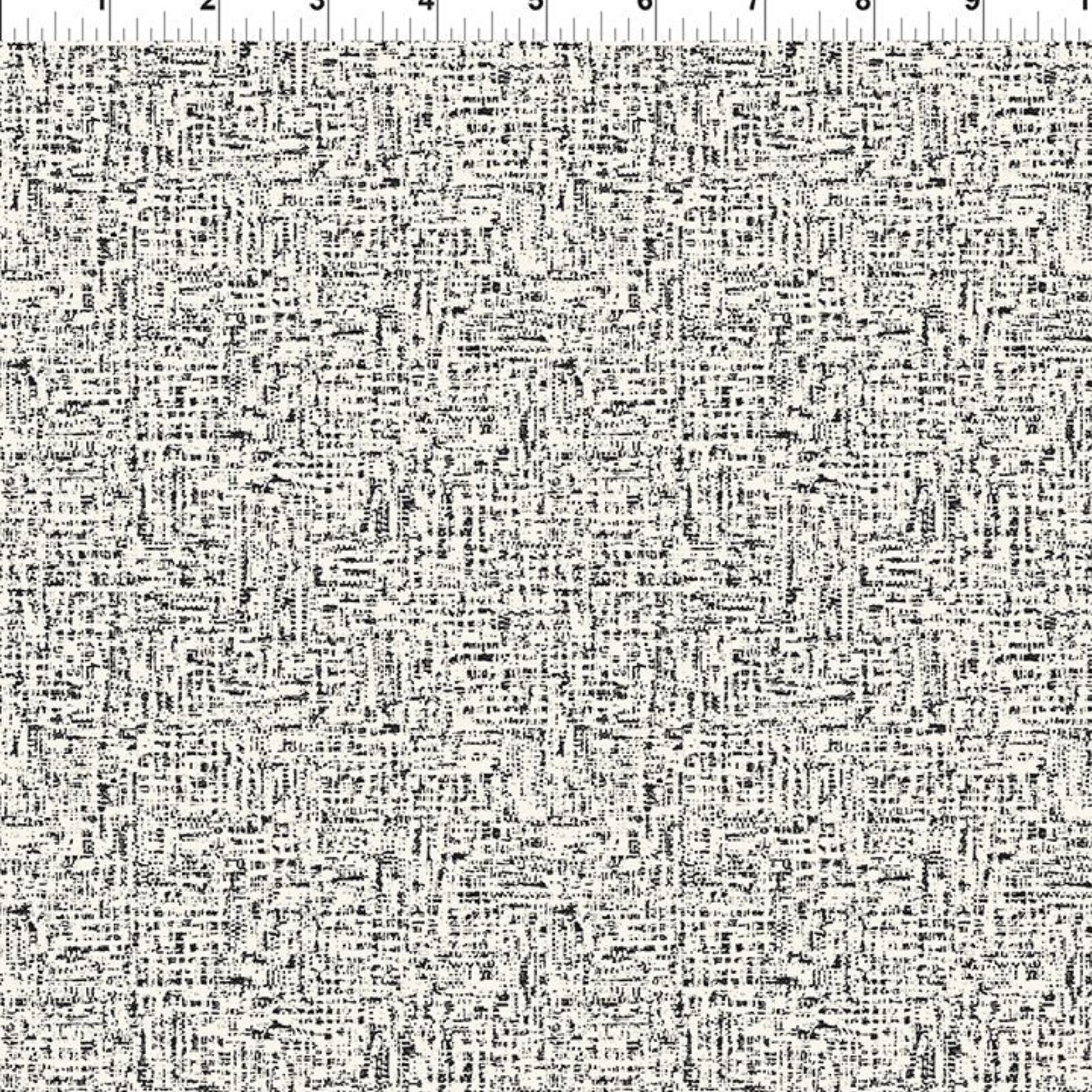 Black and white abstract scribble patterned fabric with a white ruler at the top showing measurements in inches.