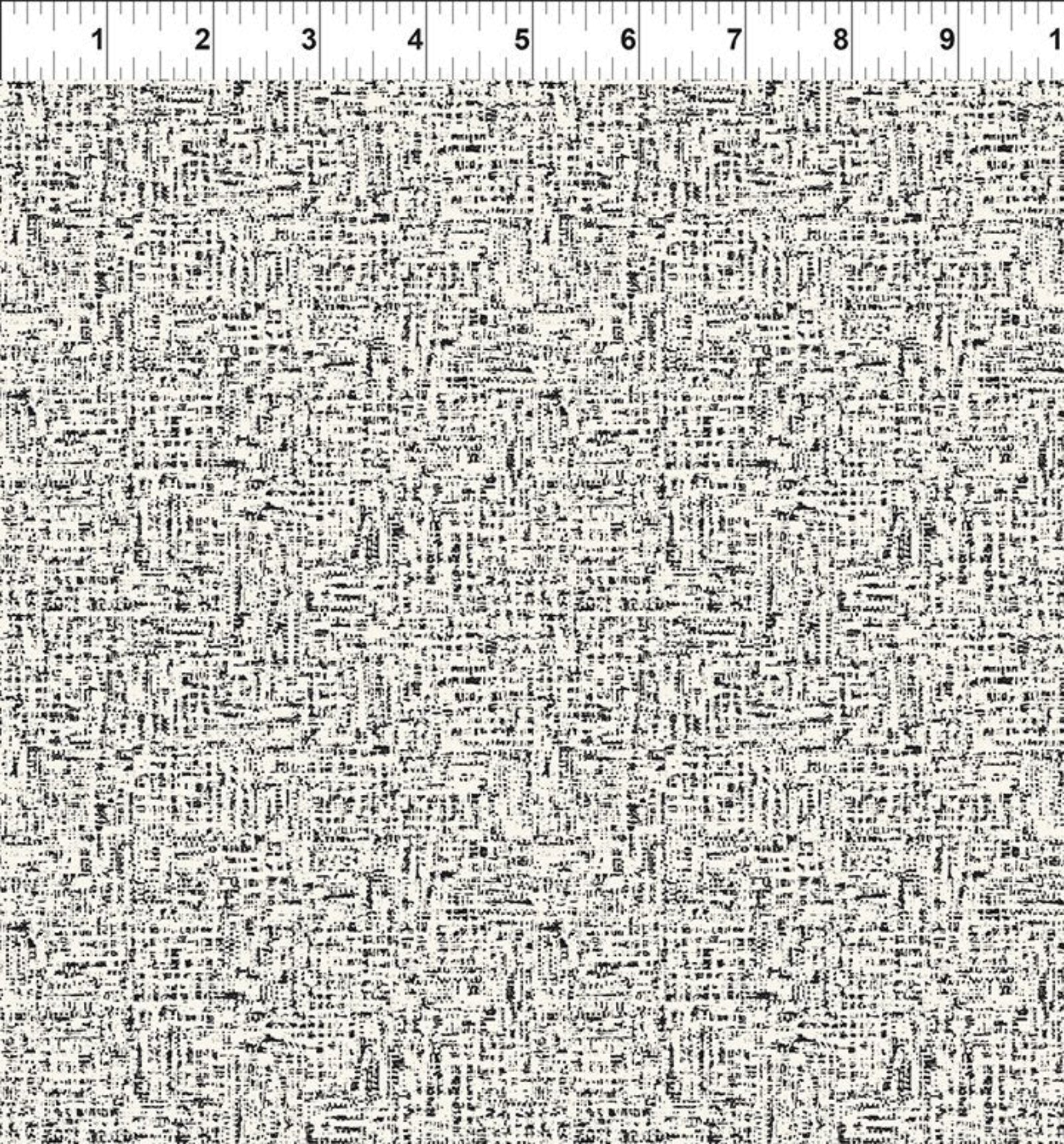 Black and white abstract scribble patterned fabric with a white ruler at the top showing measurements in inches.
