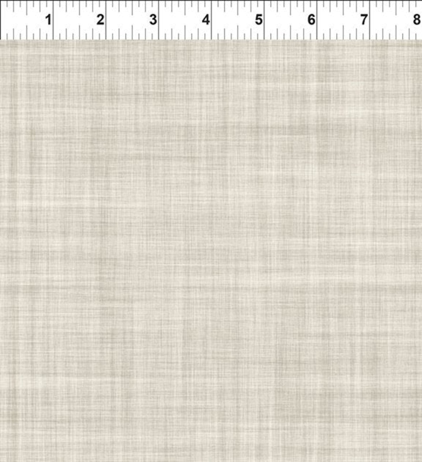 A close-up of a woven fabric texture in a light beige/cream color, with a white ruler at the top edge showing measurement markings for scale.