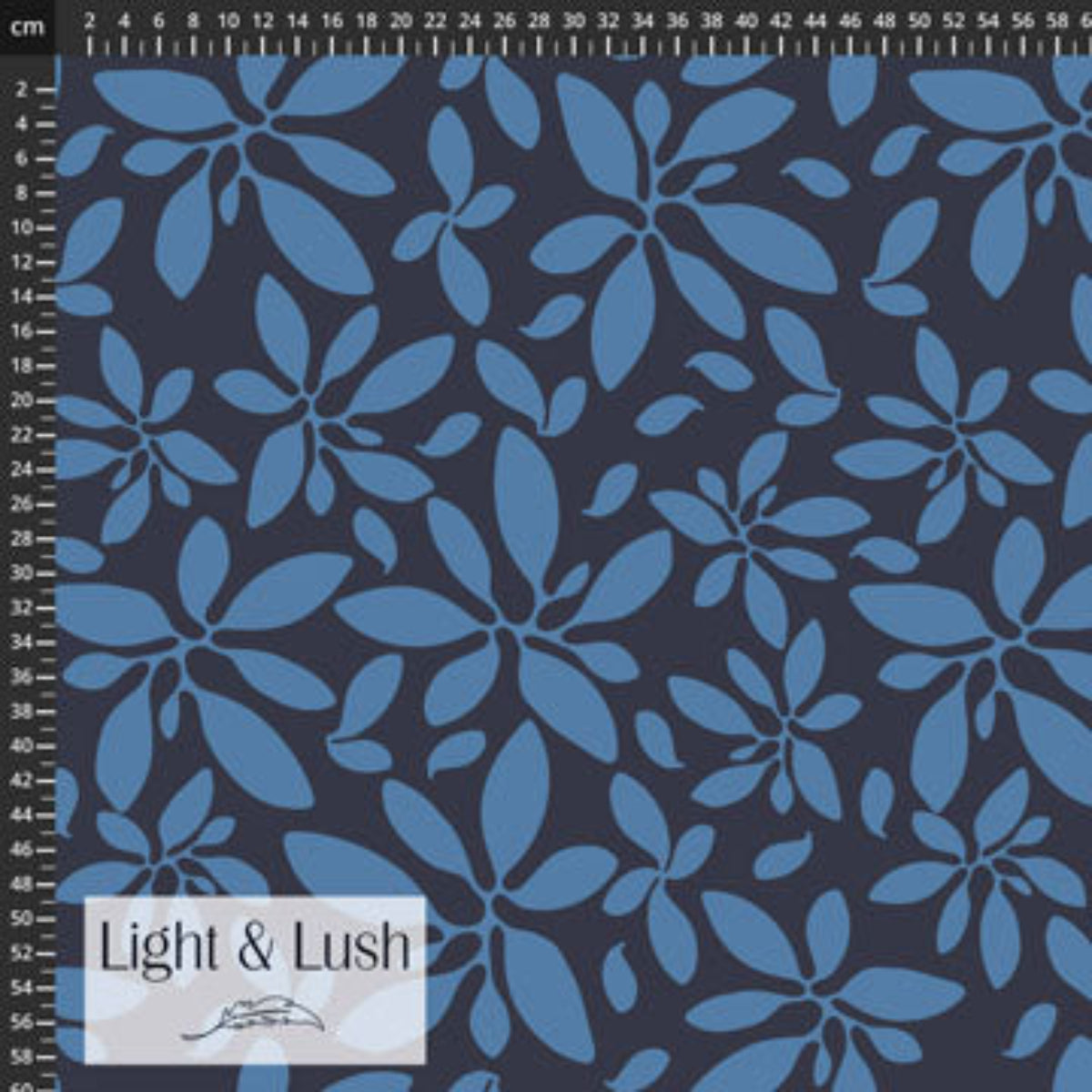 Blue floral pattern fabric with measurement scale and 'Light & Lush' label.