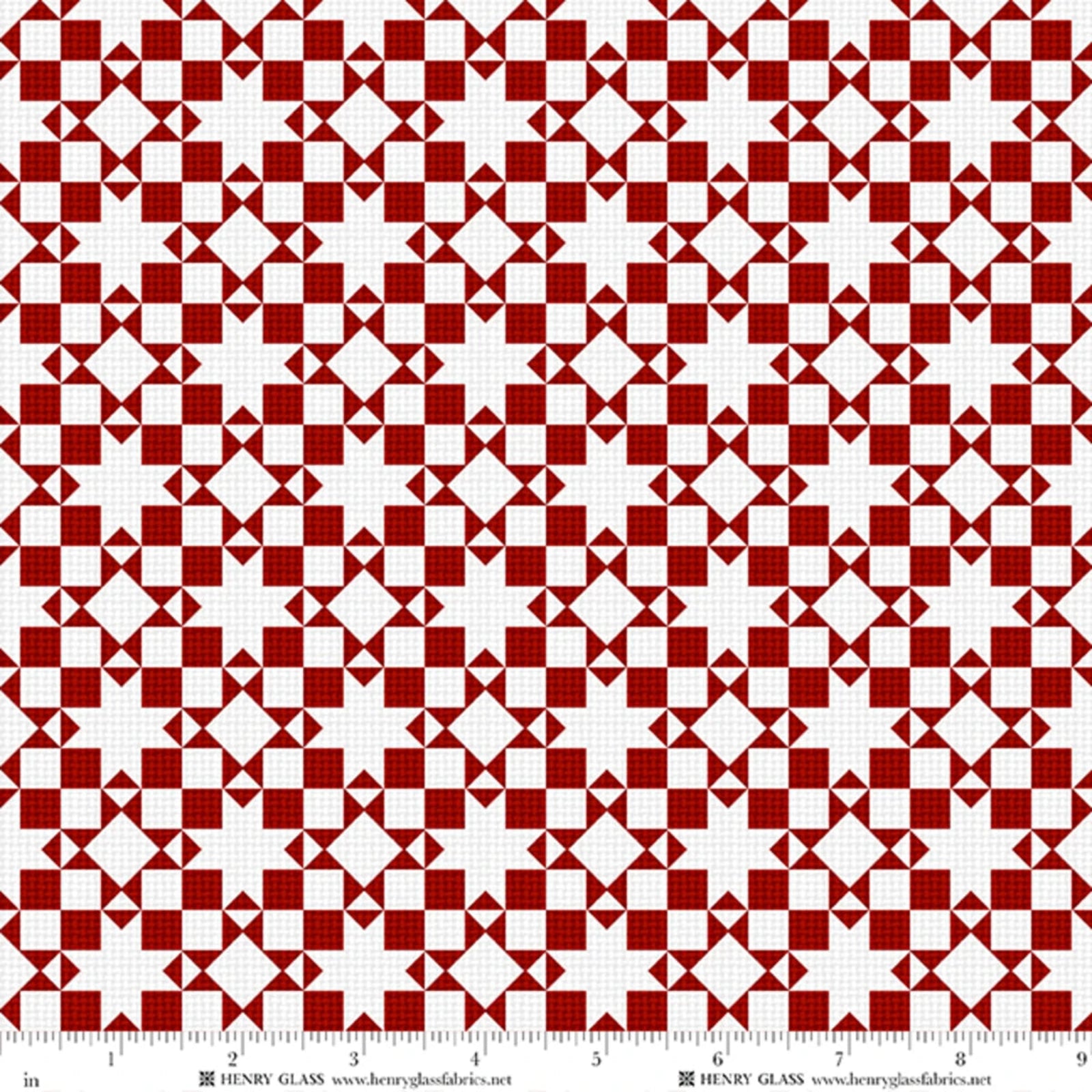 Red and white geometric patterned fabric with a repeating diamond and triangle motif, shown flat with a ruler along the bottom edge for scale. Brand text 'HENRY GLASS' is visible at the bottom.
