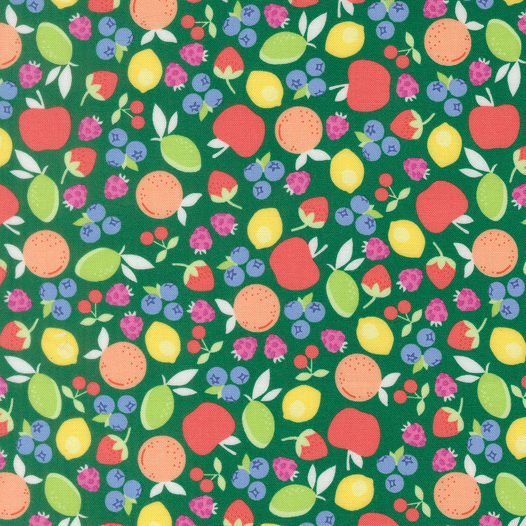 Colorful pattern of fruits and berries on a green background
