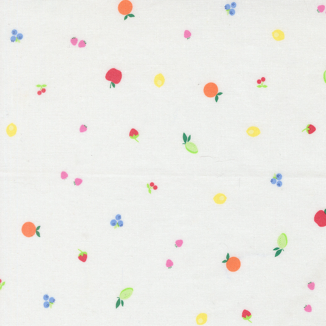 Pattern of small colorful fruits and berries on a white background