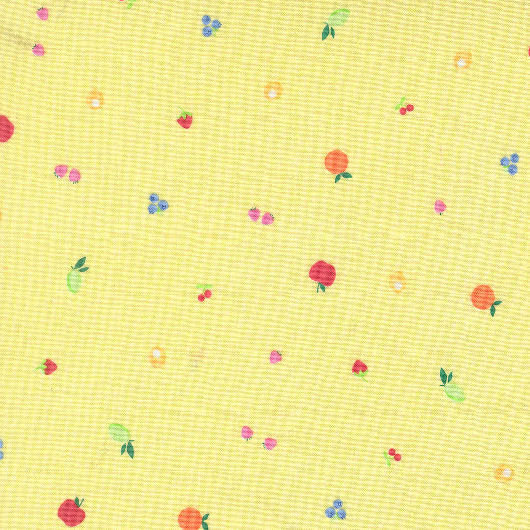 Pattern of small fruits and berries on a yellow background