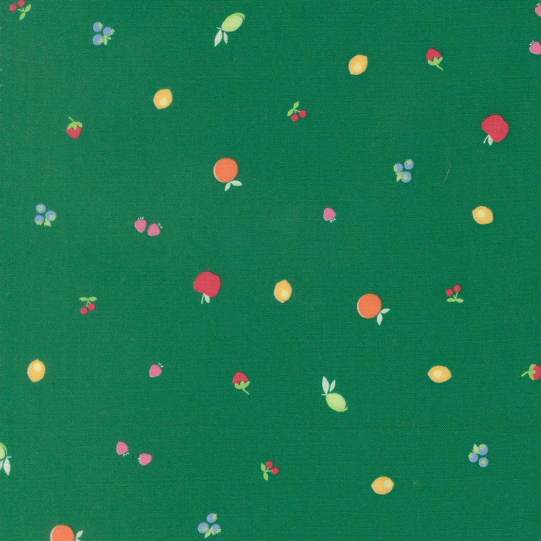 Pattern of fruits and berries on a green background