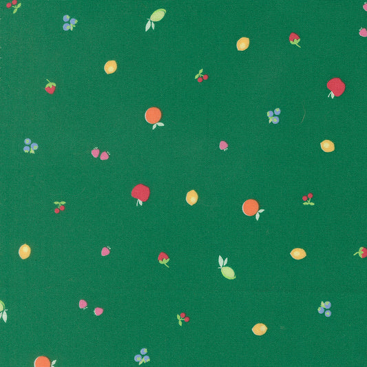 Pattern of fruits and berries on a green background