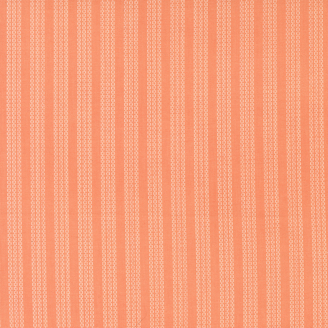 Patterned fabric with vertical stripes on a orange background