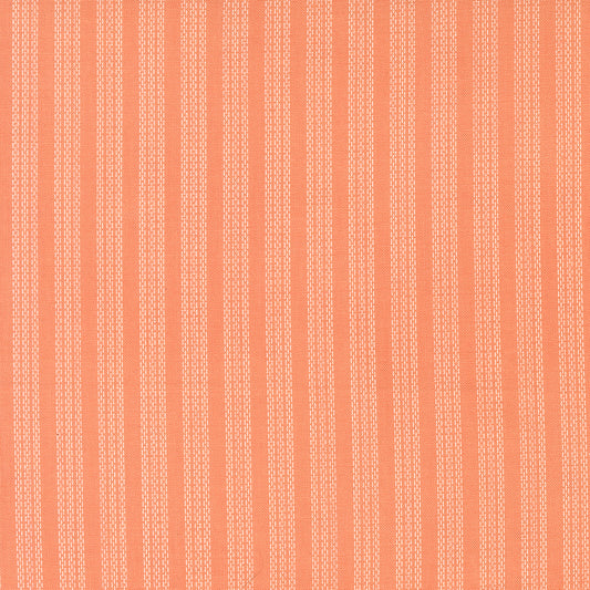 Patterned fabric with vertical stripes on a orange background
