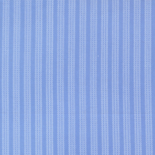 Blue fabric with white verticle stripe pattern