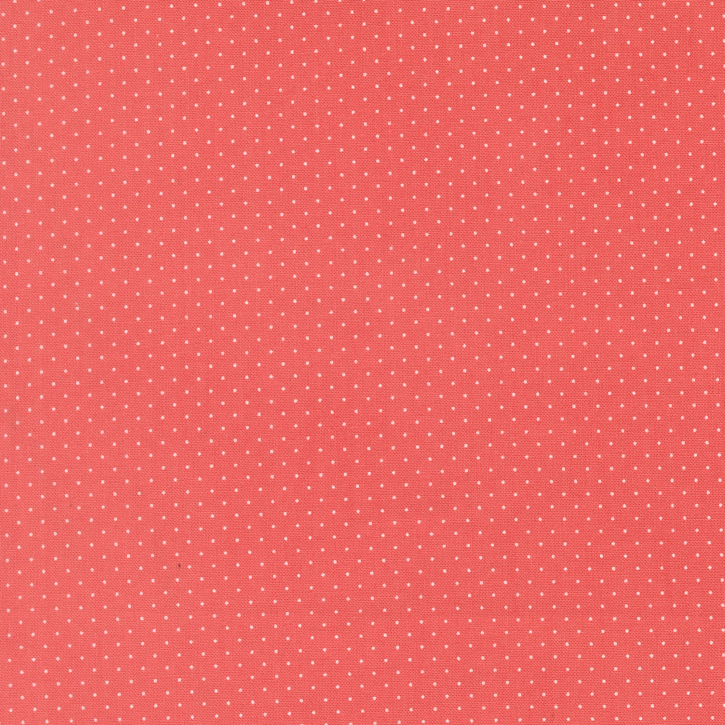 Red fabric texture with small white polka dots