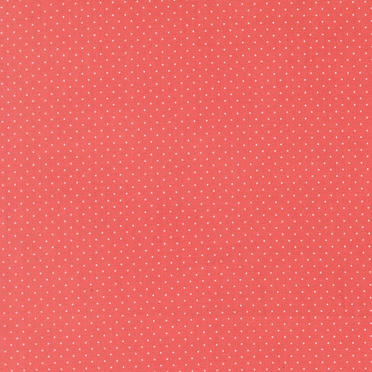Red fabric texture with small white polka dots