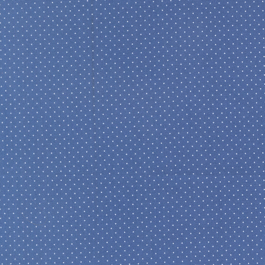 Blue fabric with small white polka dots