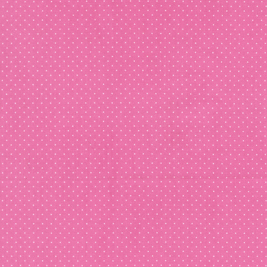 Pink background with small white polka dots