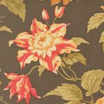 A close-up of a floral fabric pattern featuring large cream and red flowers with olive green leaves on a dark brown background.