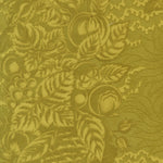 A close-up of a fabric pattern featuring a muted olive green and mustard yellow botanical design with leaves, grapes, and abstract floral motifs.