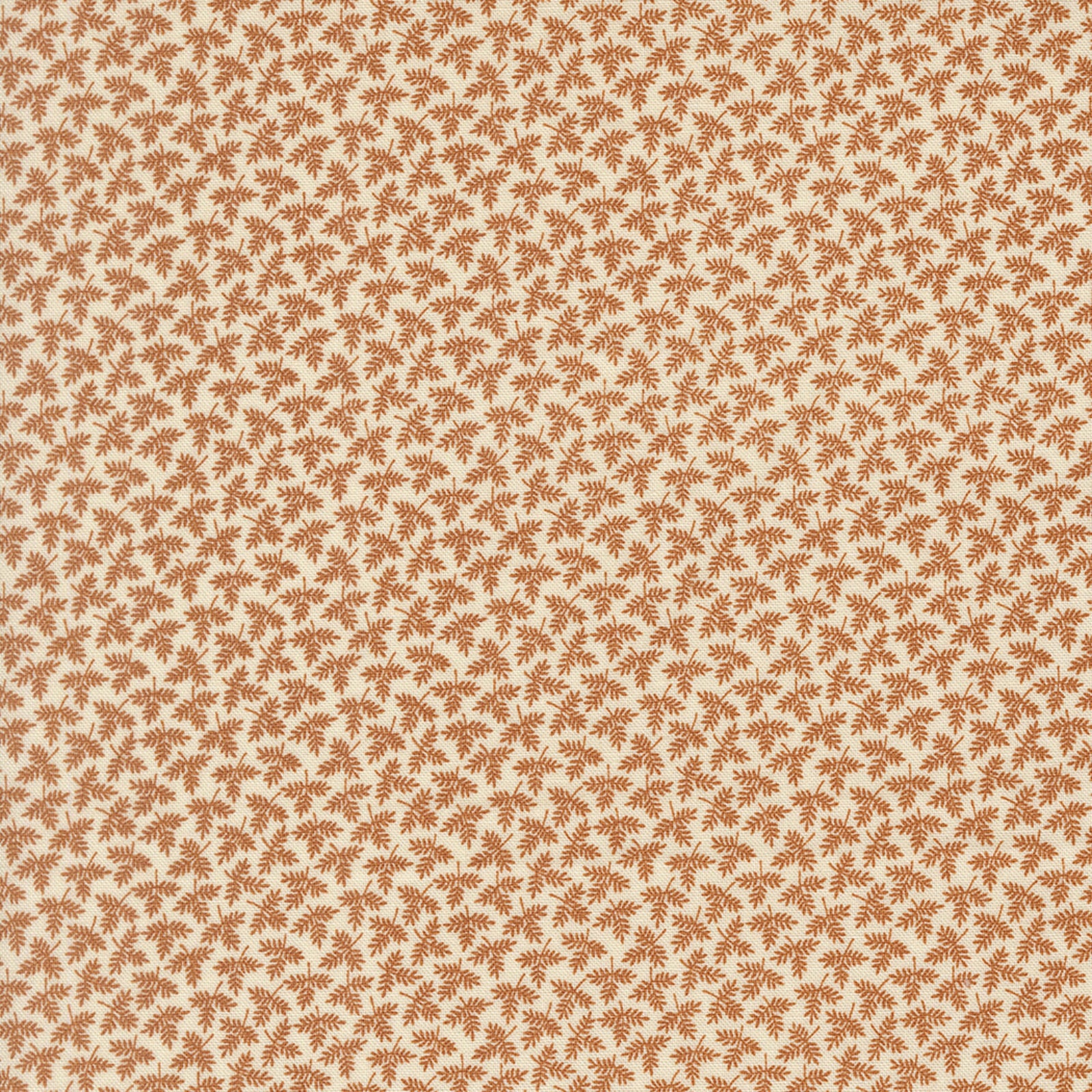 A close-up of a repeating fabric pattern featuring small brown leaf motifs on a warm cream background.