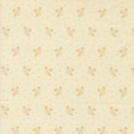 Patterned fabric with small floral elements on a beige background