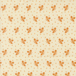 A close-up of a fabric pattern featuring a repeating motif of orange-brown floral clusters and small diamond shapes on a warm cream background.