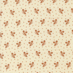 A close-up of a cream-colored fabric with a repeating brown pattern of small floral clusters and tiny diamond motifs.