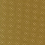 Green fabric with small white polka dots