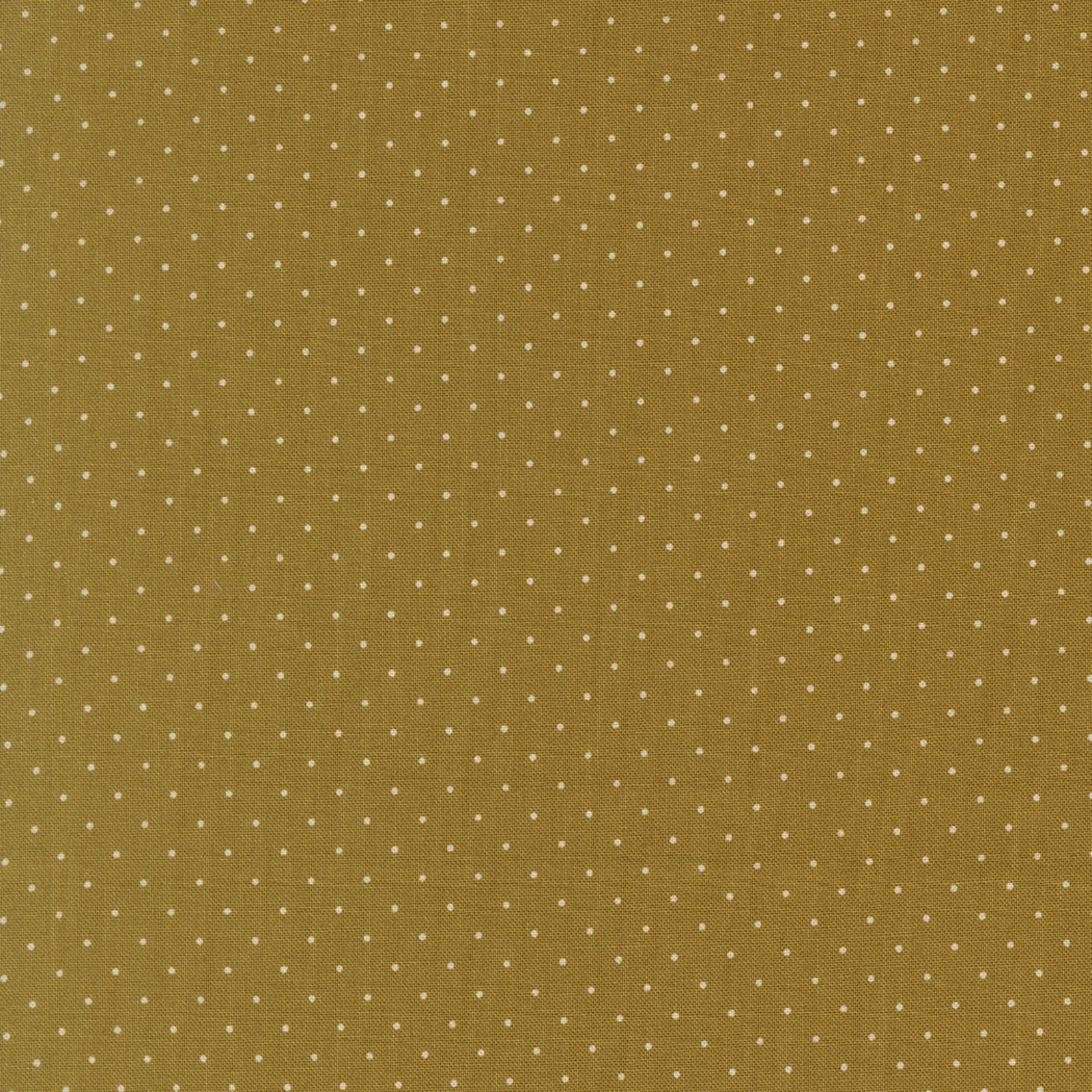 Green fabric with small white polka dots
