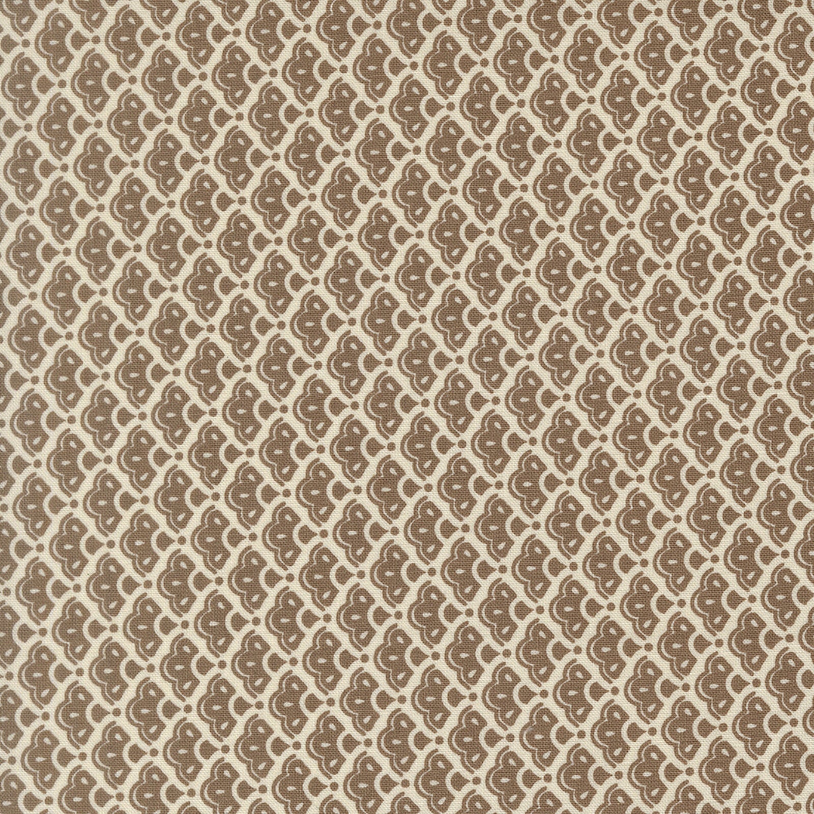 A close-up of a repeating patterned fabric design with brown abstract teardrop-like motifs arranged horizontally on a warm beige background.