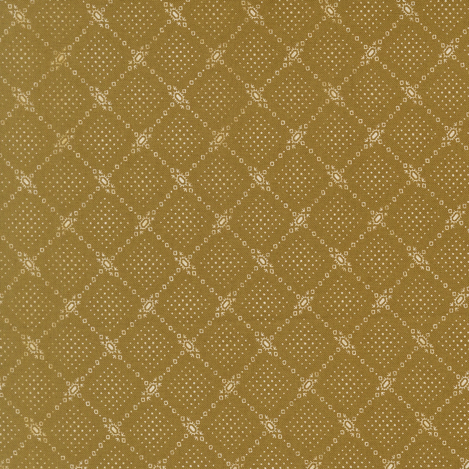 A close-up of a repeating fabric or wallpaper pattern in warm olive-gold and beige, showing a diamond lattice made of small dots and decorative floral motifs.