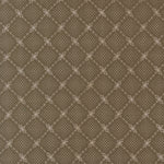 A close-up of a repeating fabric or wallpaper pattern in warm taupe-brown with a lighter beige geometric lattice and small dot motifs.