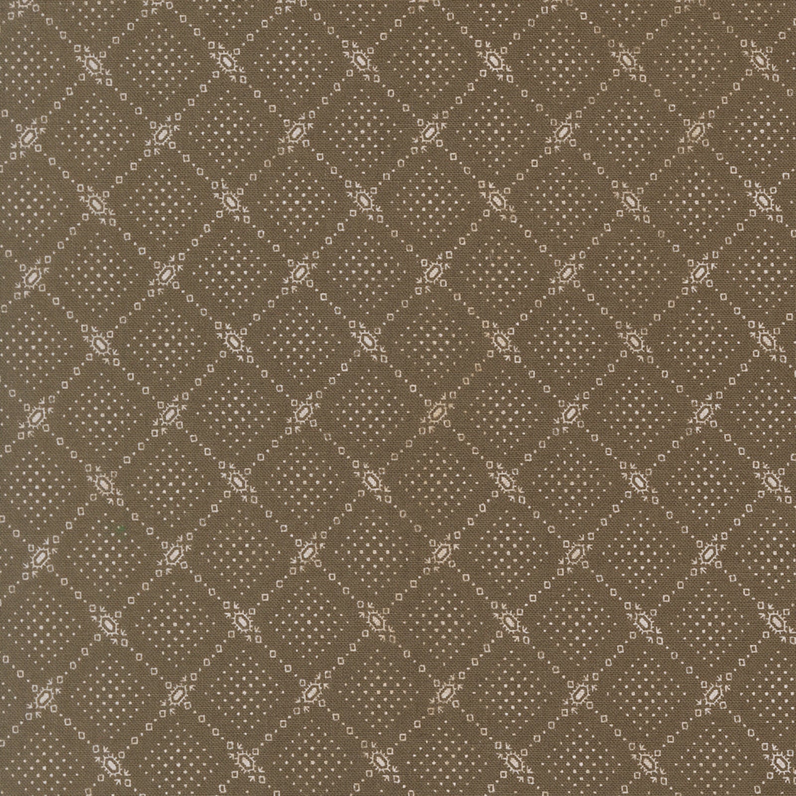 A close-up of a repeating fabric or wallpaper pattern in warm taupe-brown with a lighter beige geometric lattice and small dot motifs.