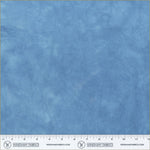 Blue fabric swatch with a ruler at the bottom for scale, branded 'Windham Fabrics'.