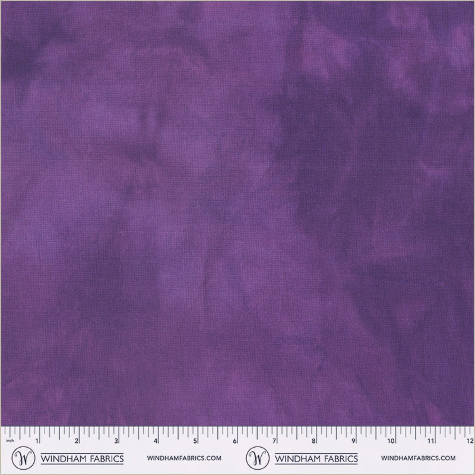 Purple fabric with a subtle pattern and a ruler at the bottom for scale, branded 'Windham Fabrics'.