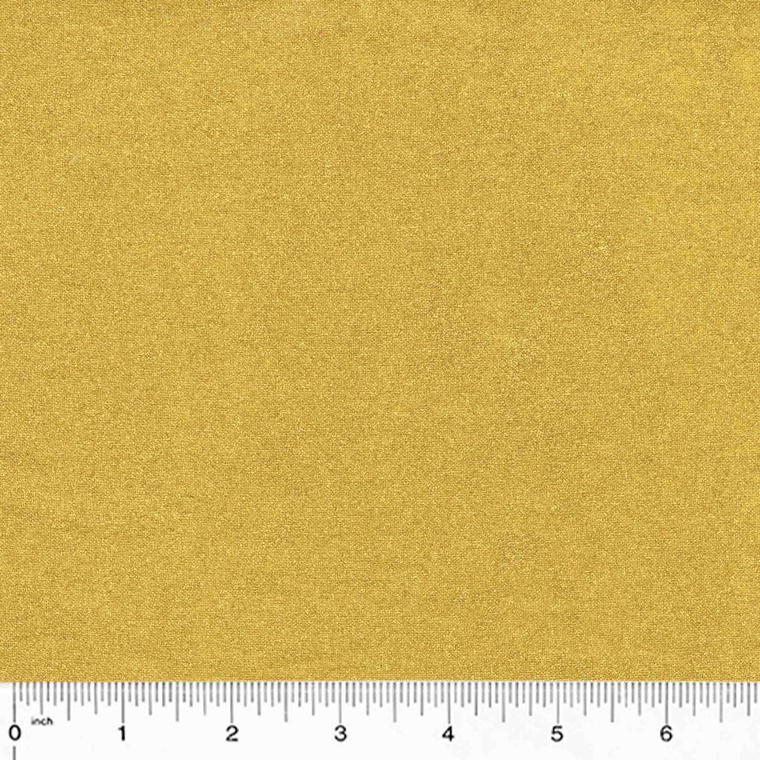 gold metallic cotton fabric with a ruler at the bottom for scale.