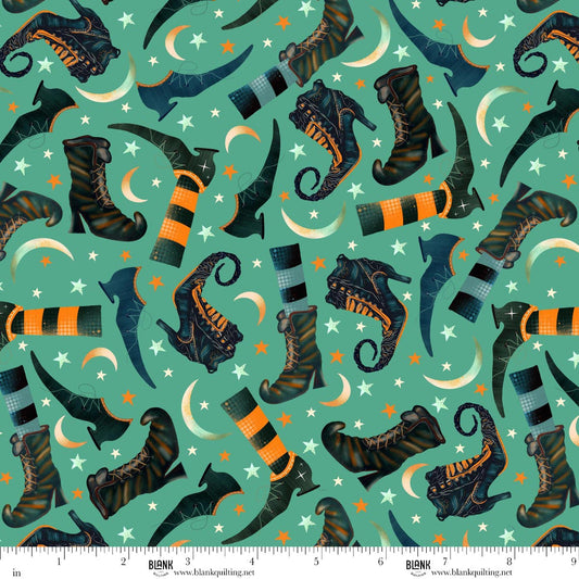 Pattern of witch boots and cats on a teal background with stars and moons.