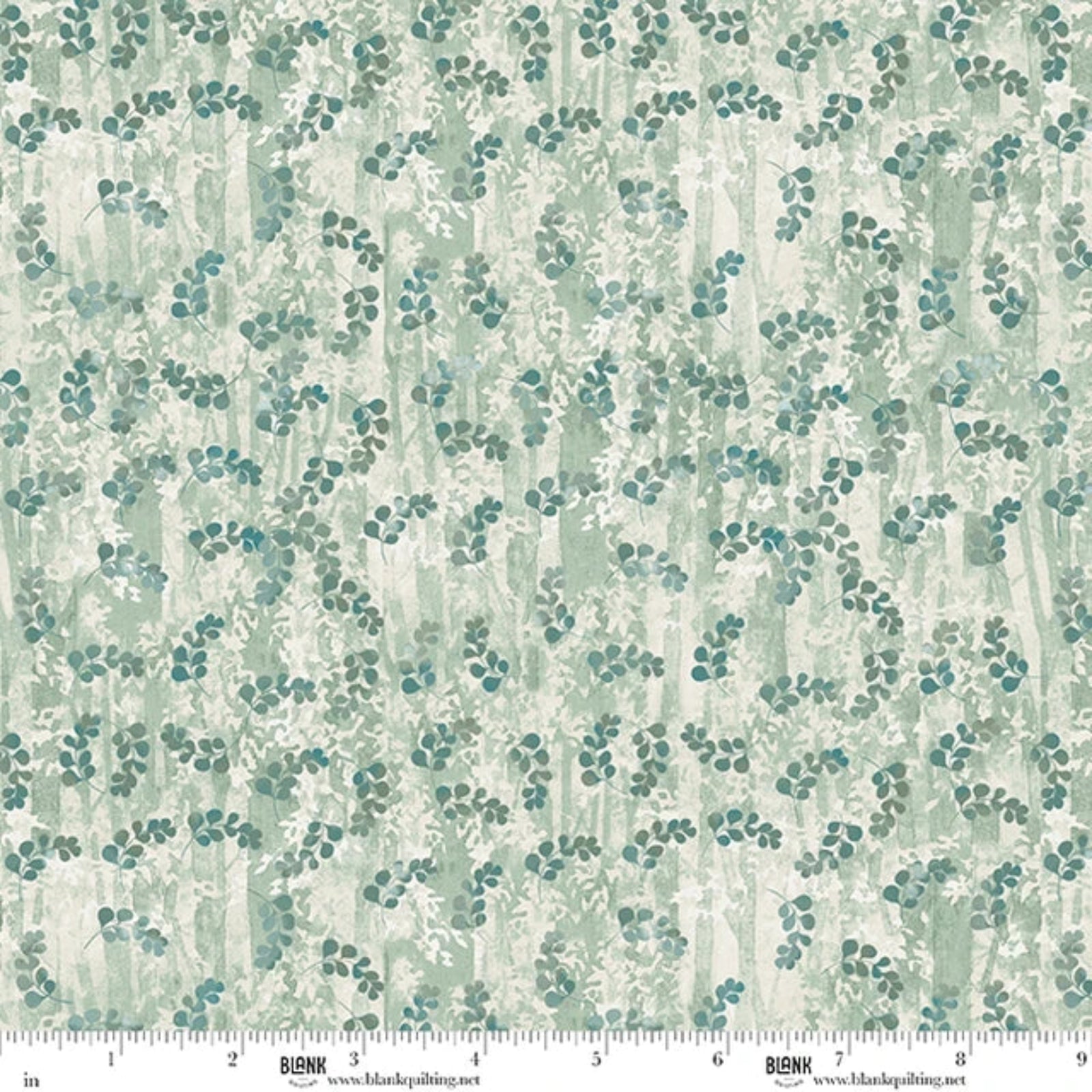 A close-up of a fabric pattern featuring a repeating design of small teal-blue leaf clusters over a soft, textured background of sage green and cream vertical brushstrokes. A white measurement ruler with 'BLANK' branding is visible along the bottom edge.