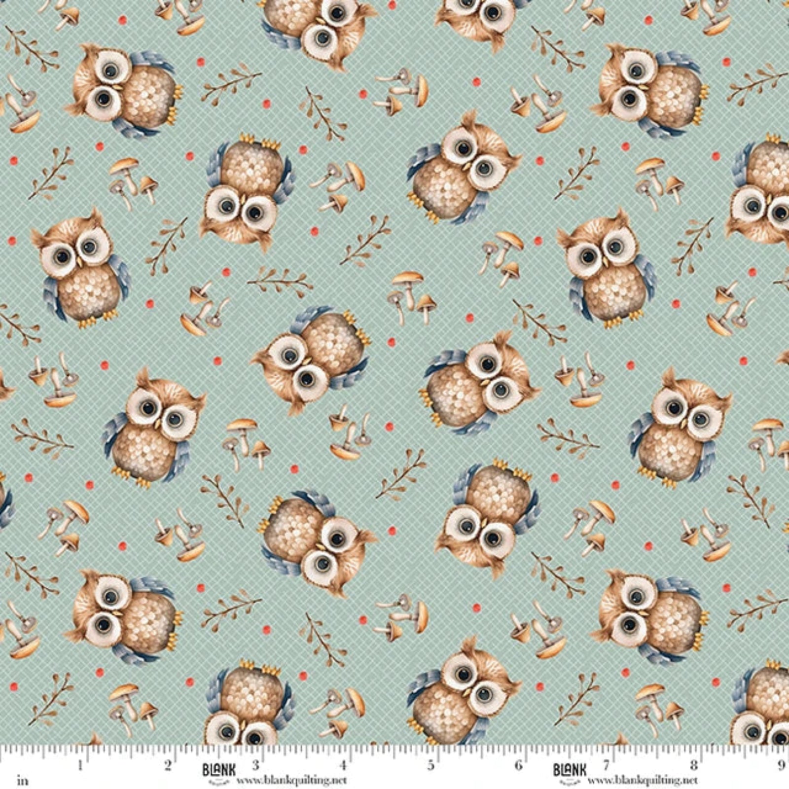 A repeating fabric pattern featuring brown and beige owls with large white eyes, set against a light teal background with a subtle grid pattern, small red dots, and scattered brown mushrooms. A white ruler with 'BLANK' branding is visible along the bottom edge.