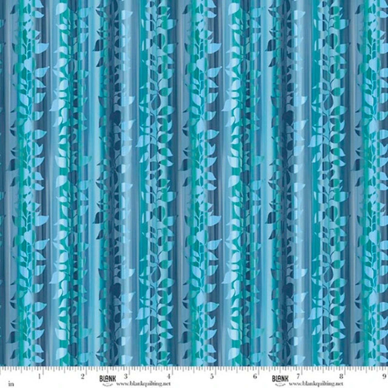 A close-up of a blue and teal patterned fabric with vertical stripes and leafy vine motifs, shown with a measuring ruler along the bottom edge.