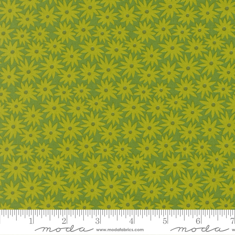 Green floral pattern fabric with a ruler at the bottom