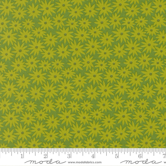 Green floral pattern fabric with a ruler at the bottom
