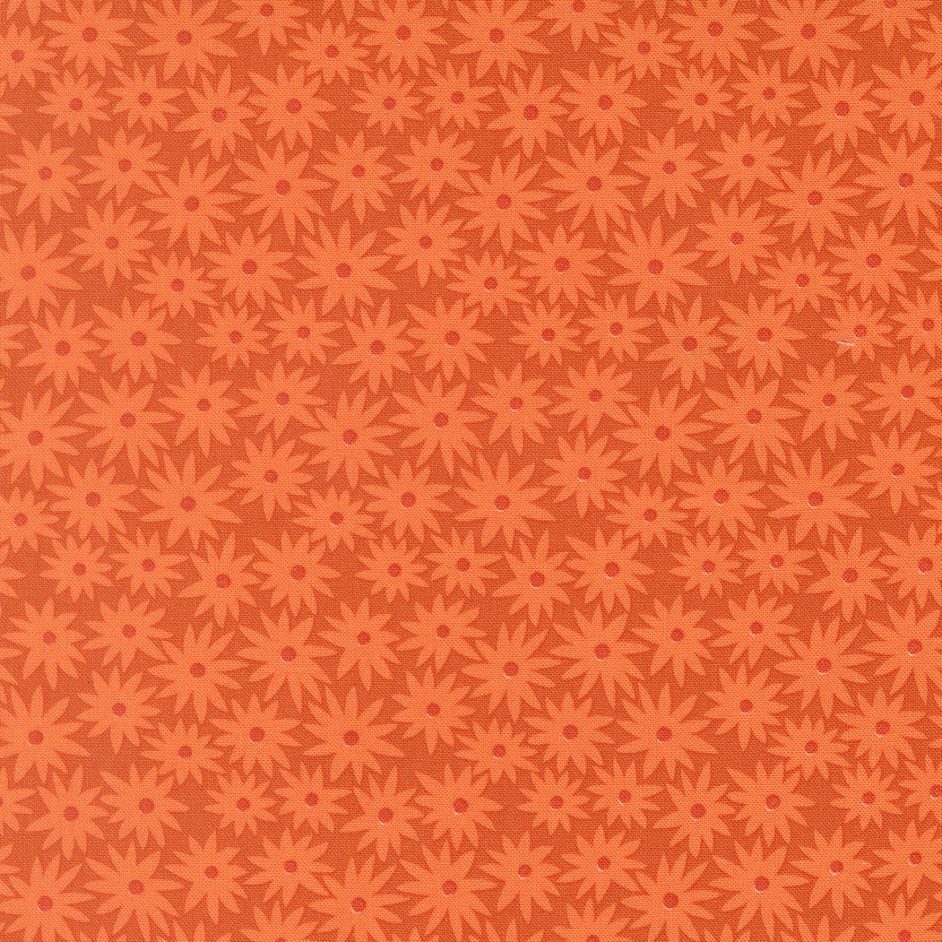 Pattern of red flowers on a brown background