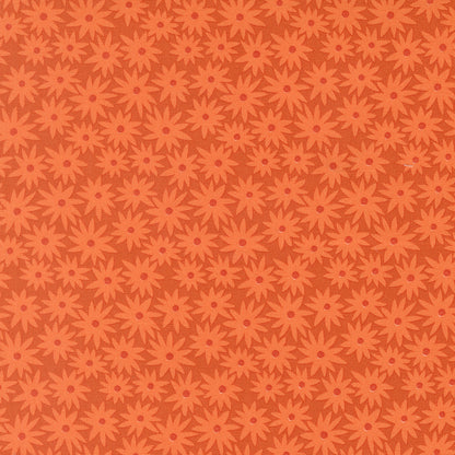Pattern of red flowers on a brown background