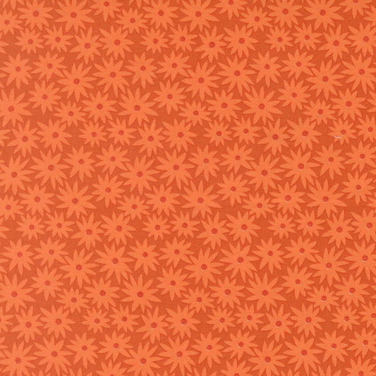 Pattern of red flowers on a brown background