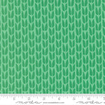 Green leaf pattern fabric with a ruler at the bottom
