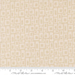 Beige fabric with geometric pattern with a ruler for scale